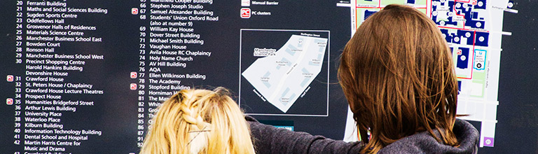 Students reading from a campus map