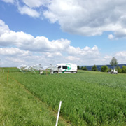 The GasLab van parked in a green field.