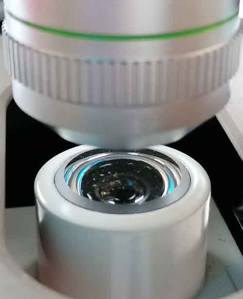 A close-up of a microscope lens.
