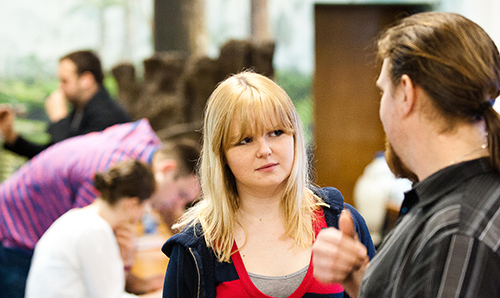 A student in conversation with her tutor